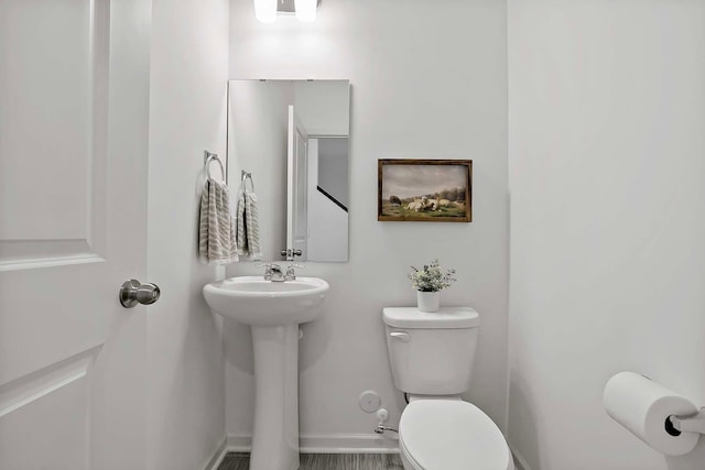 bathroom featuring sink and toilet