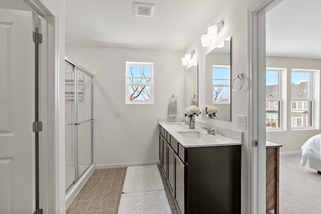 bathroom with vanity and walk in shower