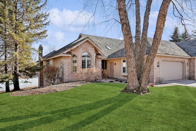 ranch-style house with brick siding, an attached garage, a chimney, and a front lawn