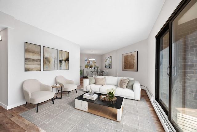 6615 Lake Shore Dr S Unit 311, Richfield, MN 55423 - living room with wood finished floors, a baseboard radiator, and a chandelier
