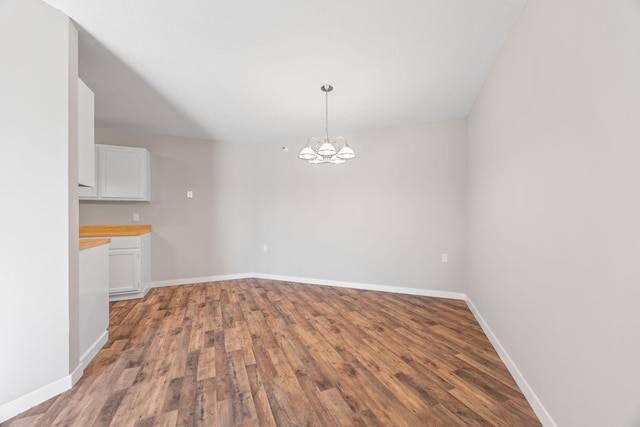 6615 Lake Shore Dr S Unit 311, Richfield, MN 55423 - unfurnished dining area with wood finished floors and a chandelier