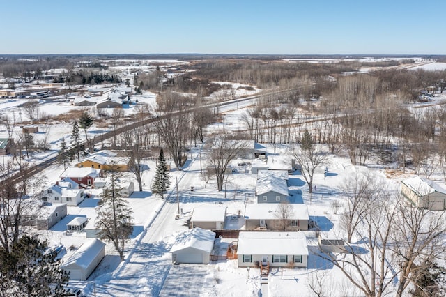 snowy aerial view featuring a residential view