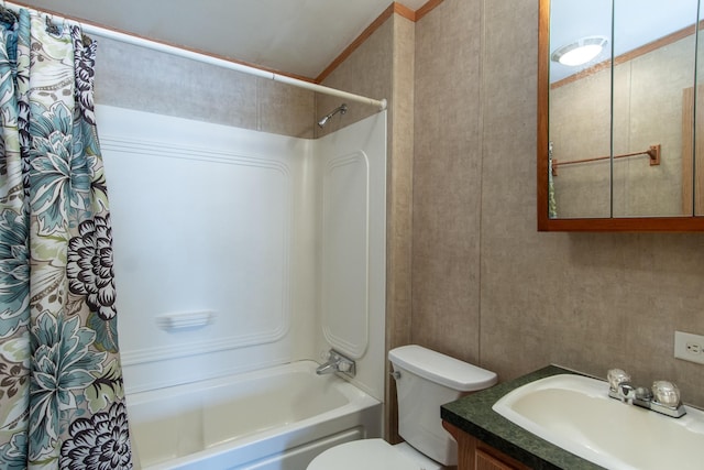 bathroom featuring toilet, shower / tub combo, and vanity