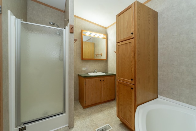 bathroom with a stall shower, visible vents, crown molding, and vanity