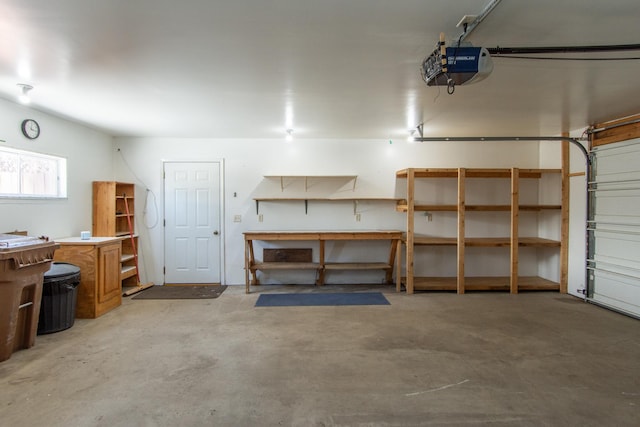 garage featuring a garage door opener and a workshop area