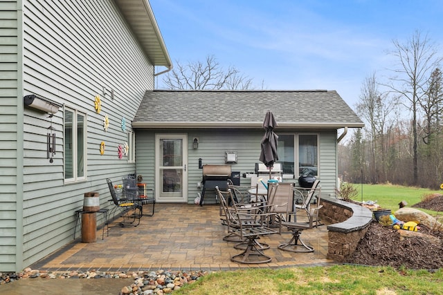 view of patio featuring a grill