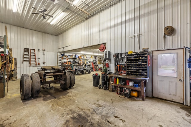 garage featuring ceiling fan and a workshop area