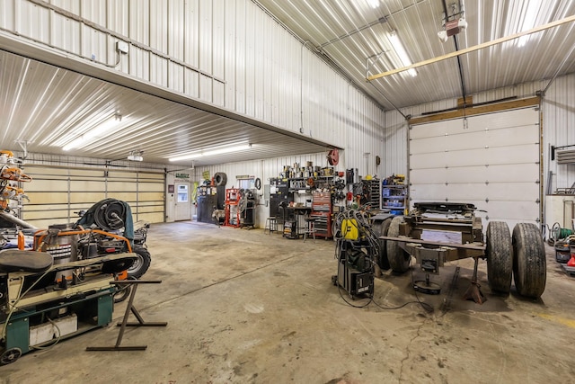 garage featuring a workshop area and a garage door opener