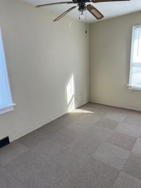 207 7th St SW, Austin, MN 55912 - carpeted empty room with a ceiling fan