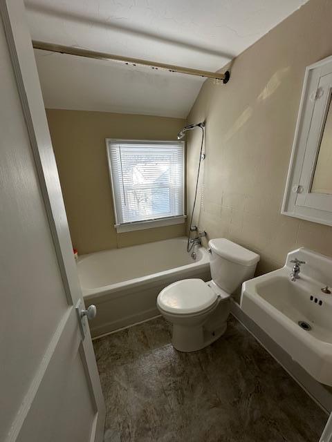 207 7th St SW, Austin, MN 55912 - bathroom with a sink, toilet, and tub / shower combination