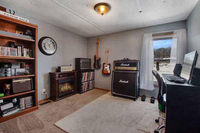 office space with light colored carpet and a textured ceiling