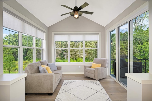 sunroom / solarium featuring ceiling fan and vaulted ceiling