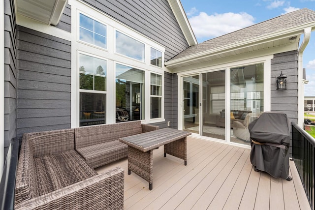 wooden terrace featuring a grill and outdoor lounge area