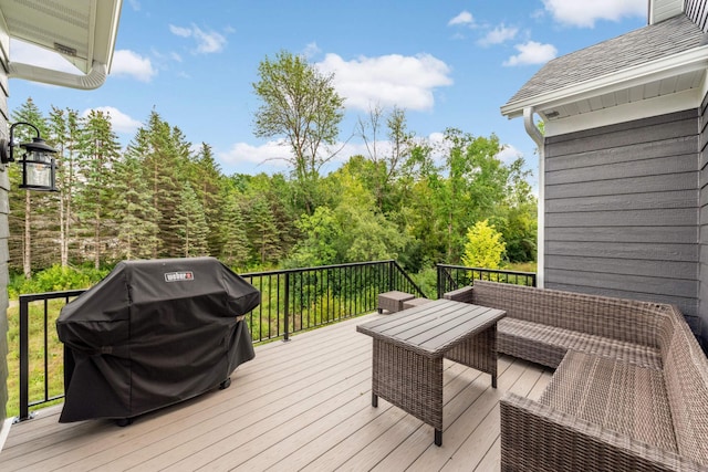 deck featuring a grill and an outdoor hangout area