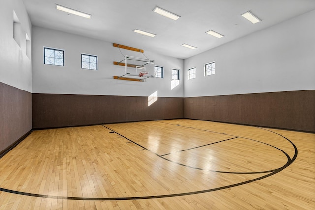 view of basketball court featuring plenty of natural light and community basketball court