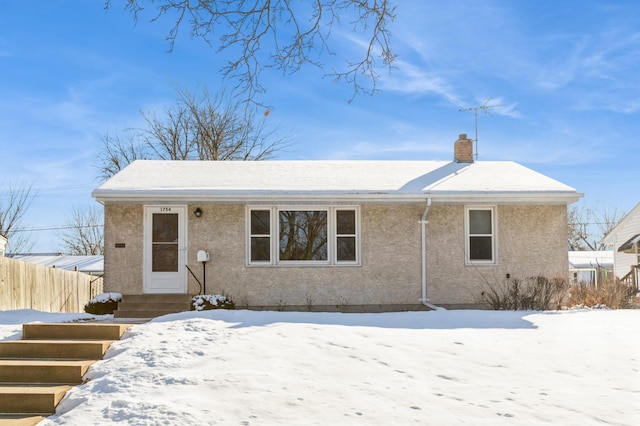 view of snow covered house