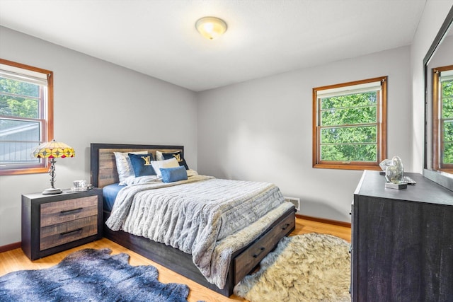 8224 Morris Rd, Bloomington, MN 55437 - bedroom featuring light wood finished floors and baseboards