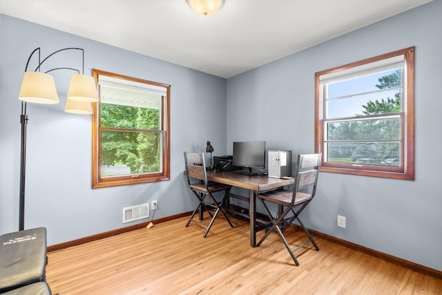 8224 Morris Rd, Bloomington, MN 55437 - office featuring wood finished floors and healthy amount of natural light