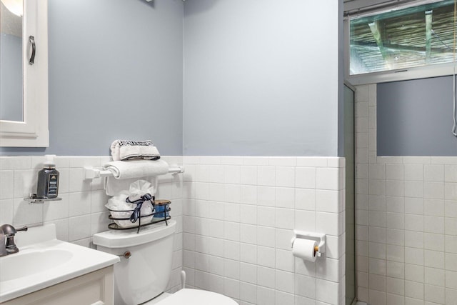 8224 Morris Rd, Bloomington, MN 55437 - full bath featuring tile walls, vanity, a wainscoted wall, and a shower