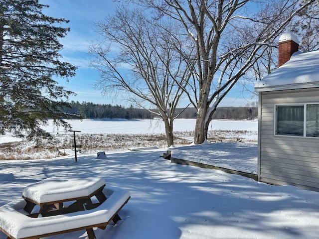 view of yard layered in snow