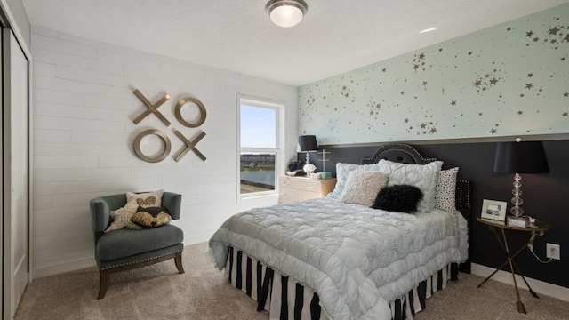 carpeted bedroom featuring a water view