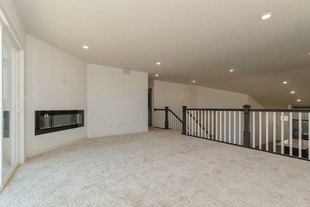 unfurnished room with light colored carpet