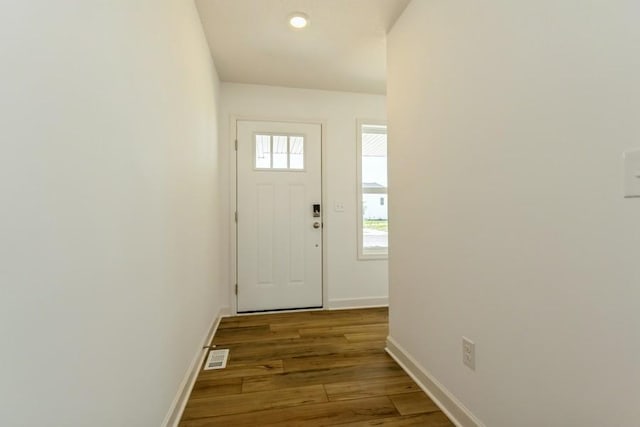 doorway featuring dark hardwood / wood-style floors