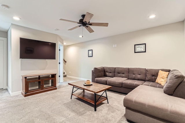 living room with light colored carpet and ceiling fan