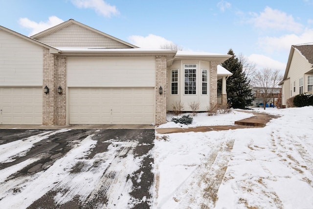 single story home with a garage