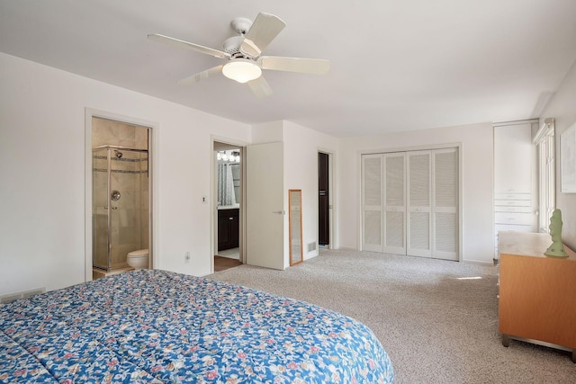 carpeted bedroom with ceiling fan and connected bathroom