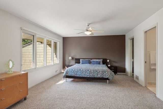 bedroom with light carpet and ceiling fan