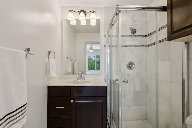 bathroom featuring an enclosed shower and vanity