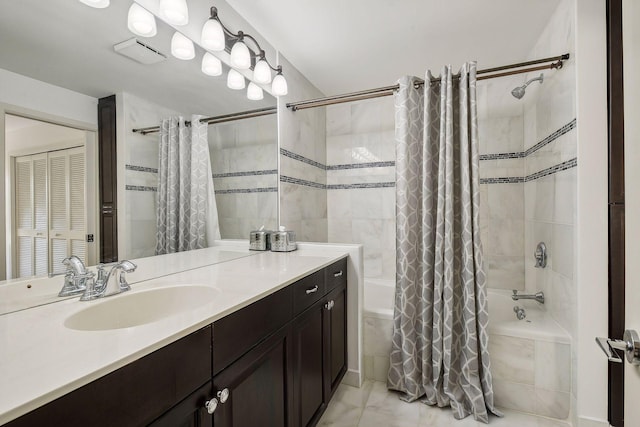 bathroom featuring shower / bath combo and vanity