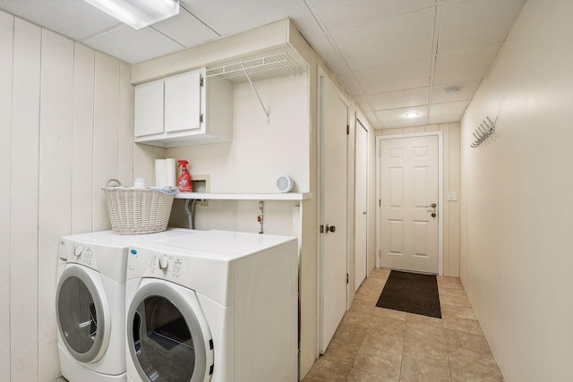 washroom featuring cabinets and washer and dryer