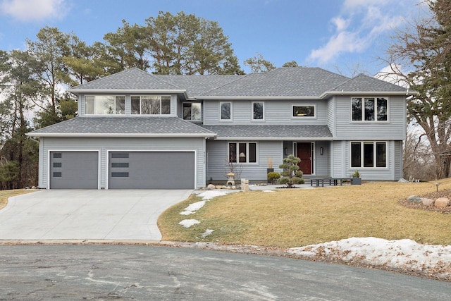 view of front of property featuring an attached garage, driveway, roof with shingles, and a front yard