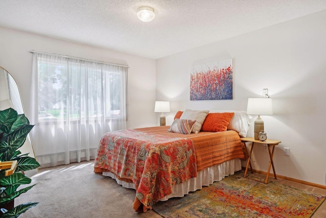 carpeted bedroom with a textured ceiling