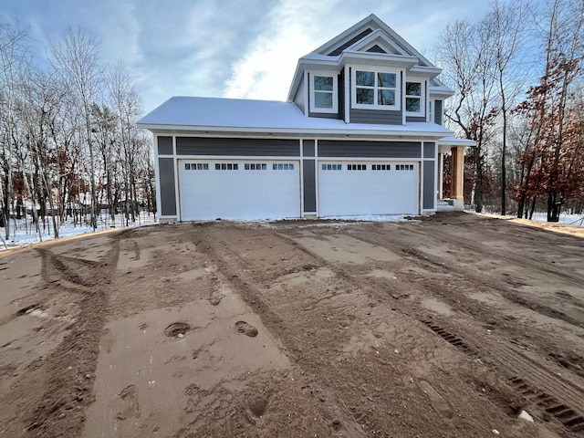 view of snow covered garage