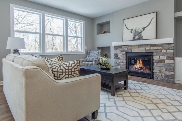 living room featuring hardwood / wood-style flooring and a fireplace