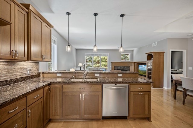 17365 Hanson Ct, Eden Prairie, MN 55347 - kitchen featuring dishwasher, light wood finished floors, and brown cabinetry