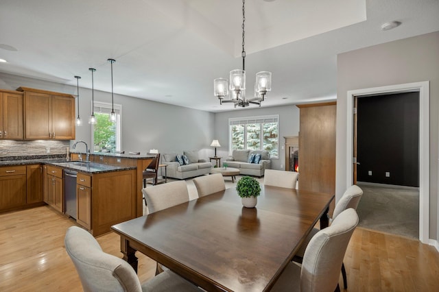 17365 Hanson Ct, Eden Prairie, MN 55347 - dining room featuring a chandelier and light wood finished floors
