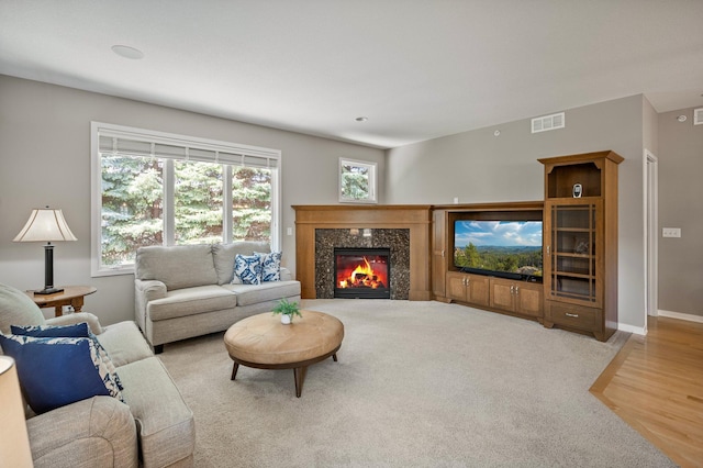 17365 Hanson Ct, Eden Prairie, MN 55347 - living room featuring a premium fireplace, wood finished floors, and baseboards