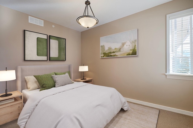 17365 Hanson Ct, Eden Prairie, MN 55347 - carpeted bedroom with baseboards