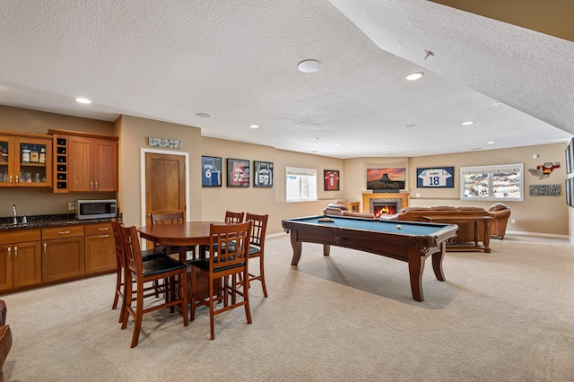 17365 Hanson Ct, Eden Prairie, MN 55347 - game room featuring a textured ceiling, light colored carpet, a lit fireplace, pool table, and recessed lighting