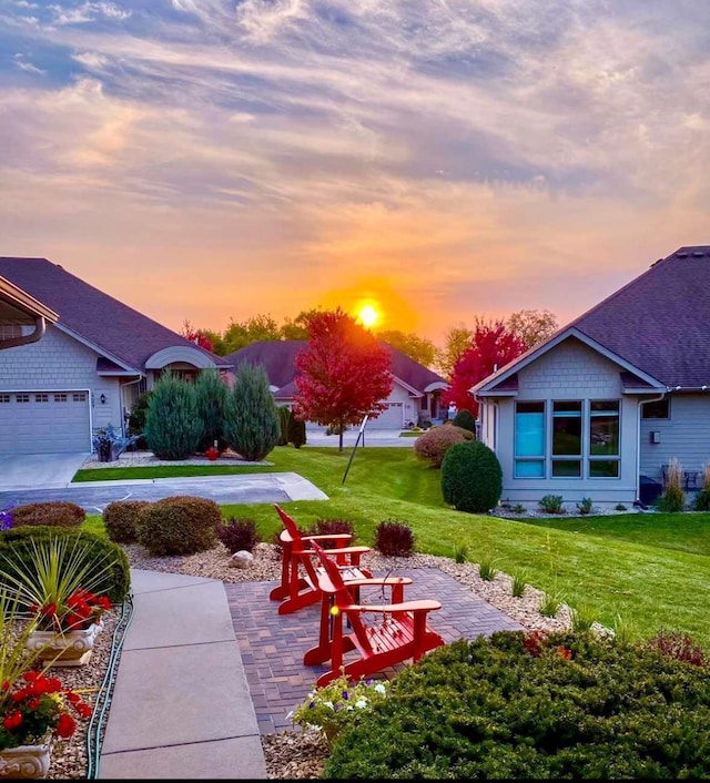 17365 Hanson Ct, Eden Prairie, MN 55347 - yard at dusk featuring a lawn
