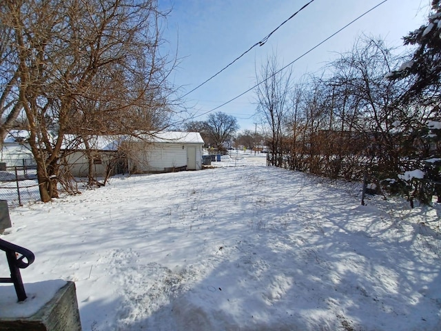 view of yard covered in snow