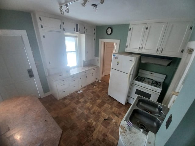 kitchen with white cabinetry, sink, white appliances, and rail lighting