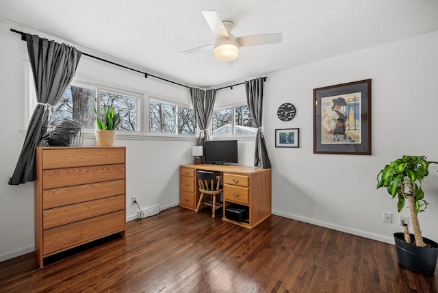 office space with dark wood-style floors, a textured ceiling, baseboards, and a ceiling fan