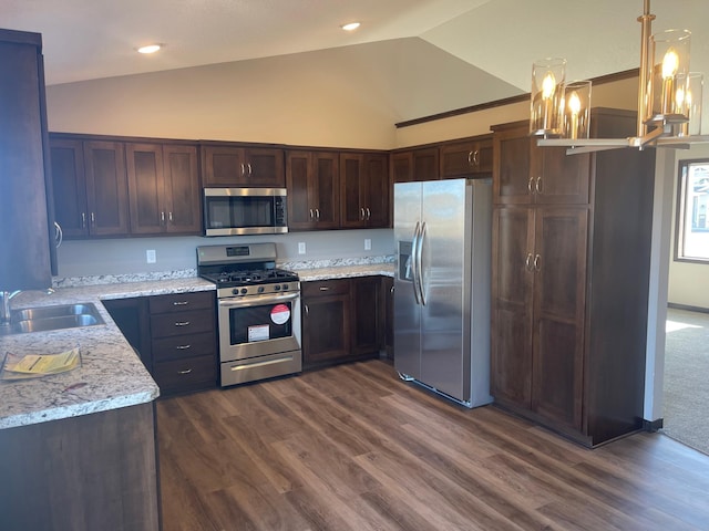 kitchen featuring light stone counters, appliances with stainless steel finishes, dark wood-type flooring, and sink