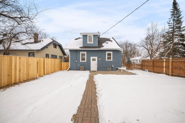 view of snow covered property