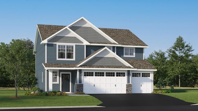 craftsman-style house featuring a garage and a front yard